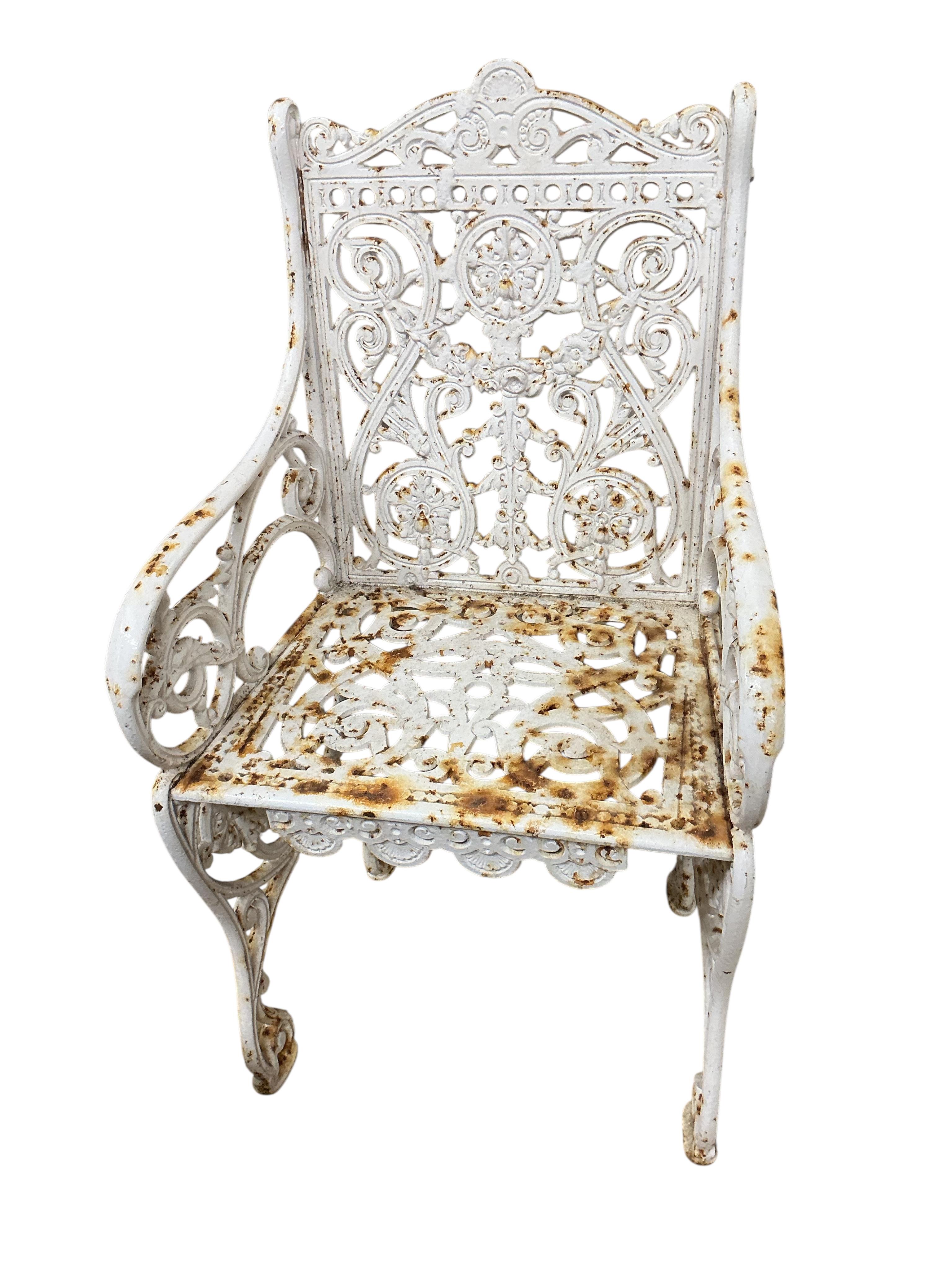 A Victorian Coalbrookdale style painted cast iron garden elbow chair, width 46cm, depth 38cm, height 88cm